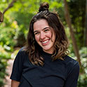 Allison is pictured fromt he shoulders up. She has brown hair, fair skin, and is smiling. 