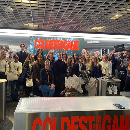 Students in the National Retail Federation student chapter pose for a photo with HRSM staff and faculty at the NRF Big Show in New York City.